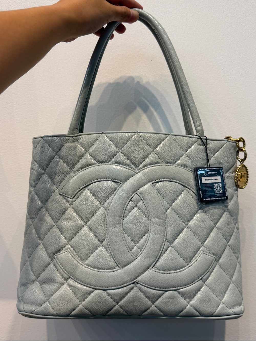 CHANEL Quilted Caviar Leather Tote in Light Gray with Gold-Tone Charm